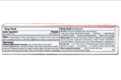 Close-up of Benzodent application on gums for easy, precise use.
