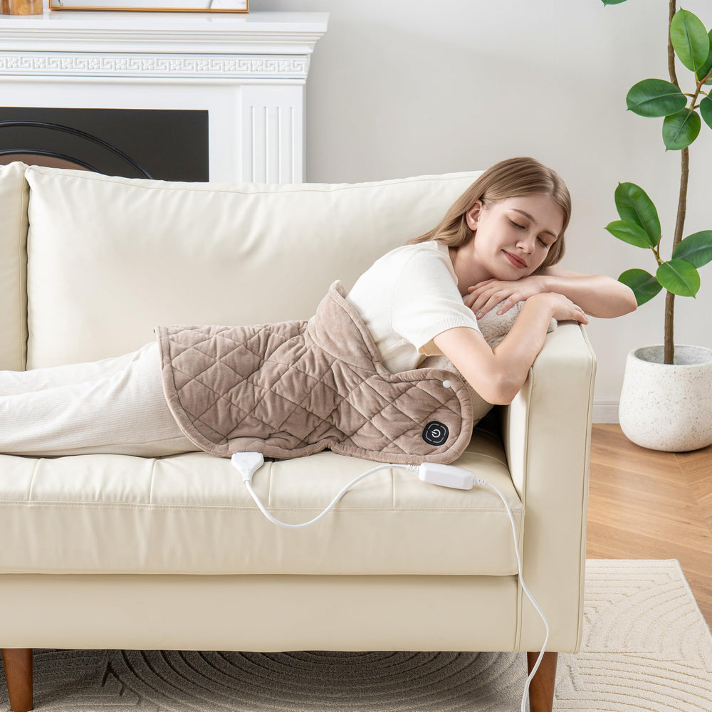 Berkshire Blanket weighted heating pad worn on shoulders to illustrate targeted warmth and coverage.