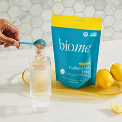 Bio.me Psyllium Husk Powder kitchen setup with non-GMO label visible.