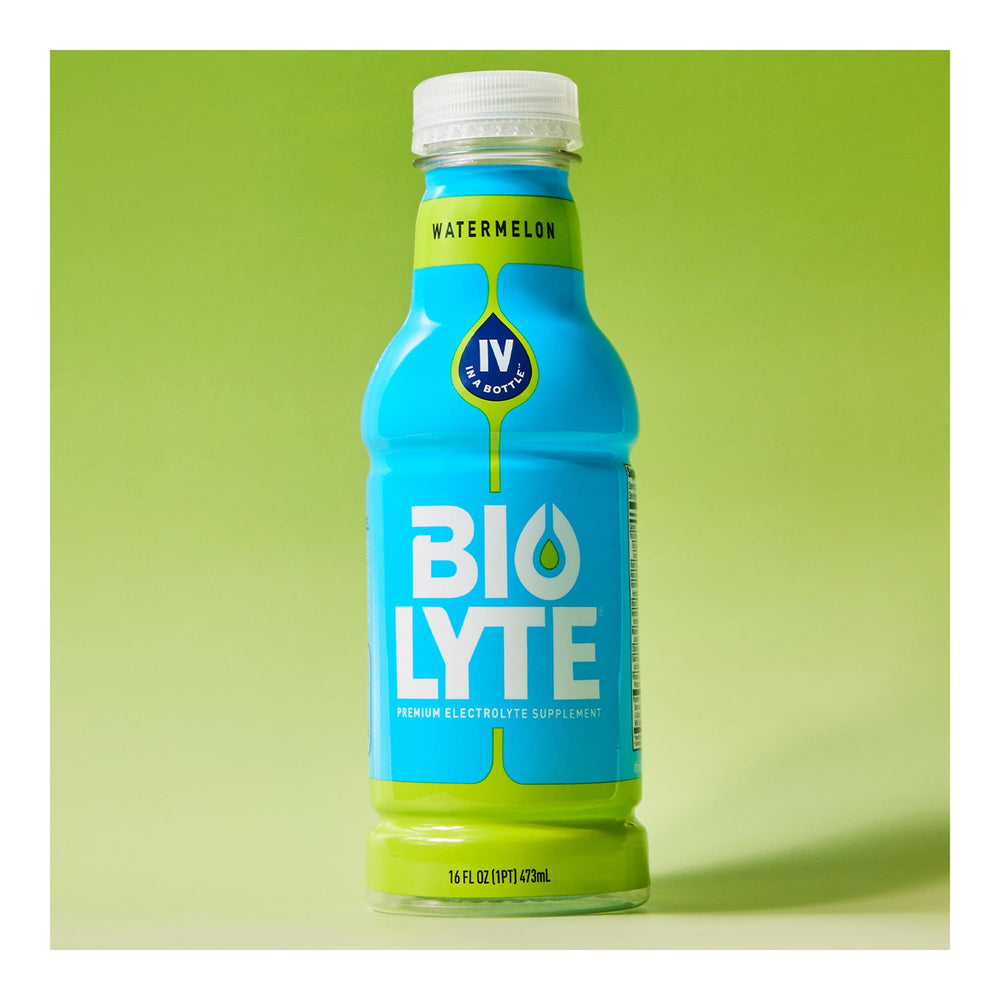 Biolyte Watermelon bottle outdoors for an active lifestyle hydration.