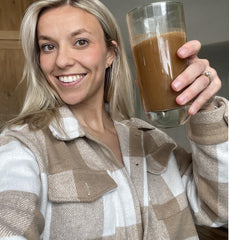 Lifestyle scene with a mug and notebook promoting focused, balanced energy