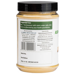 Glass jar of Bixa Botanical Ashwagandha powder, premium herbal blend