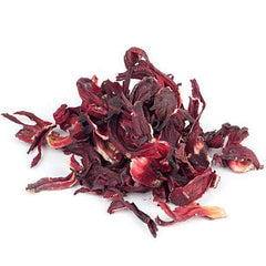Bixa Botanical Hibiscus Powder being mixed into juice for versatile use.
