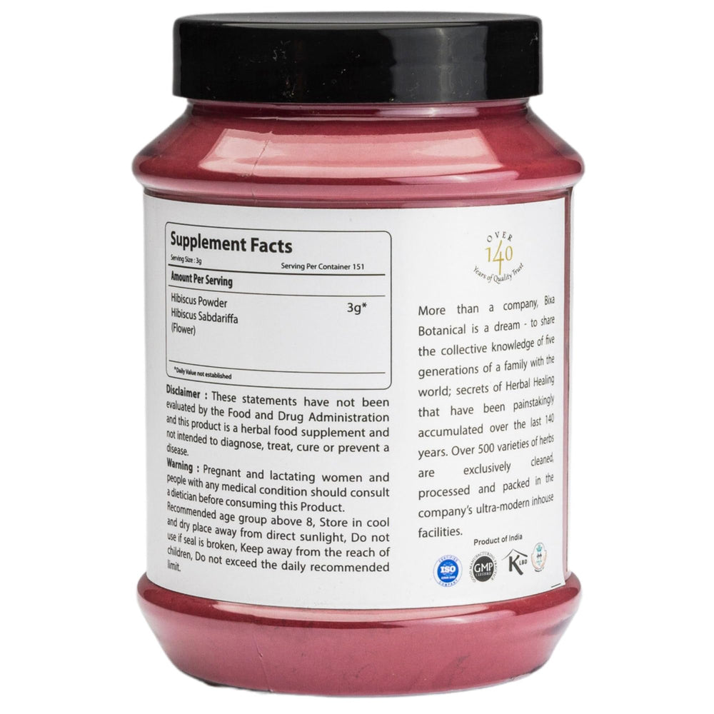 Close-up of Bixa Botanical Hibiscus Powder texture showing vibrant color and purity.