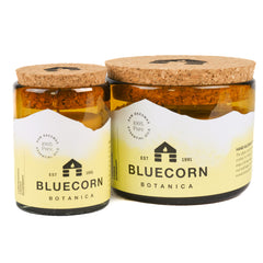 Close-up of Bluecorn amber glass jar showcasing clean beeswax burn