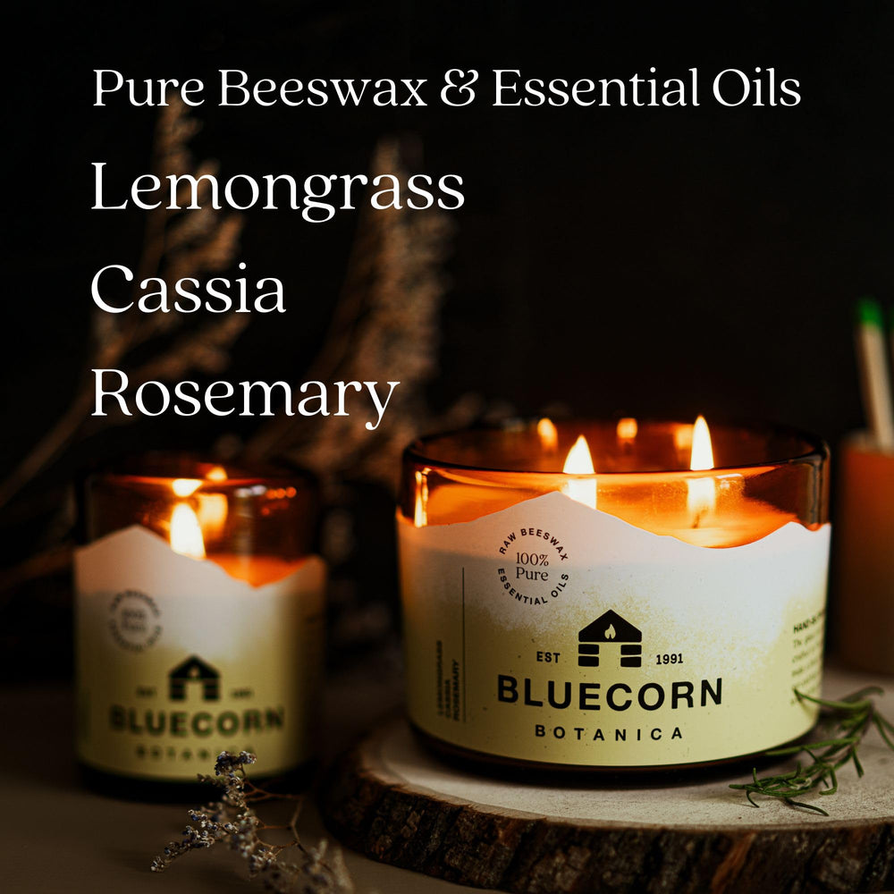 Warm golden glow from Bluecorn 3-wick candle enriching the room