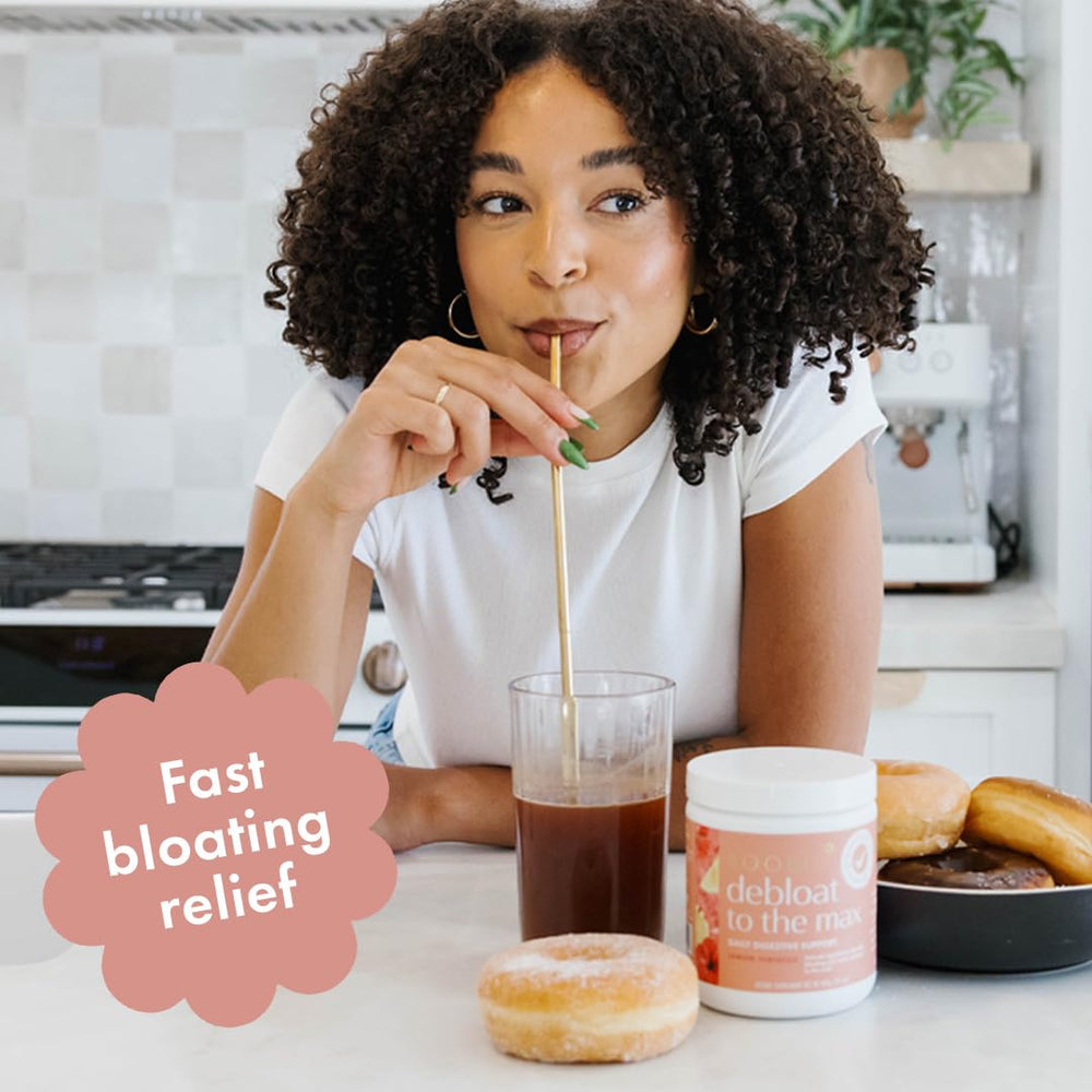 Glass with Boobie Debloat to the Max mixed in water shows convenient gut support.