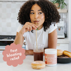 Glass with Boobie Debloat to the Max mixed in water shows convenient gut support.