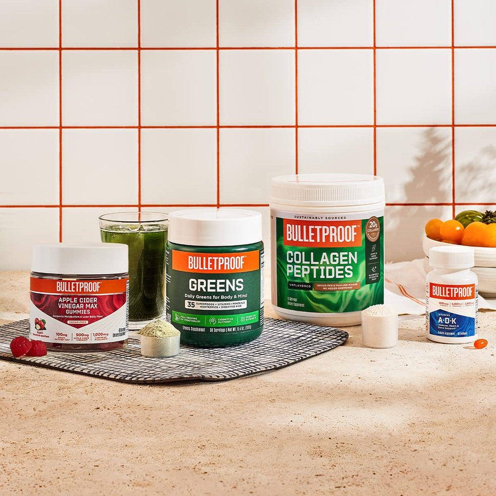 Bulletproof Greens Packets dissolving in water to form a smooth beverage