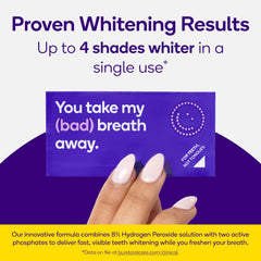 Burst Teeth Whitening Breath Strips being applied to top teeth for even whitening.