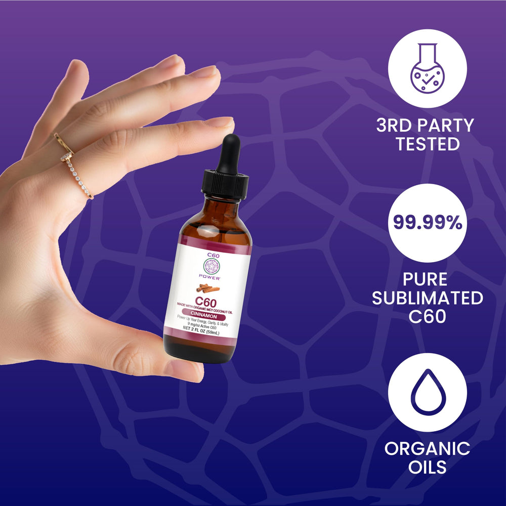 Pouring C60 Cinnamon oil into a glass for daily energy