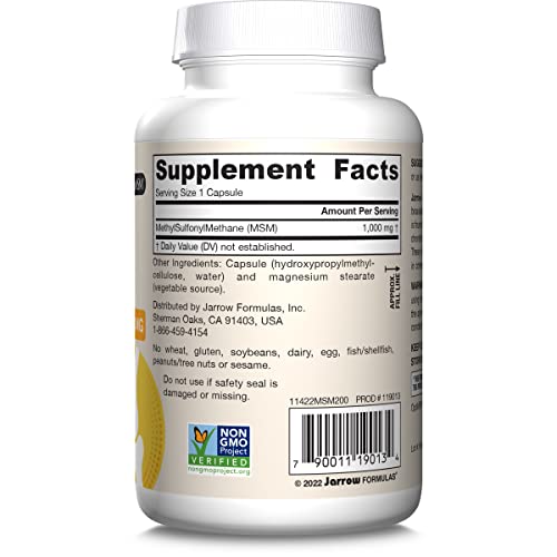 Capsules beside bottle on desk for everyday use.