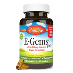 Carlson E-Gems Plus 400 IU bottle on kitchen counter during daily routine