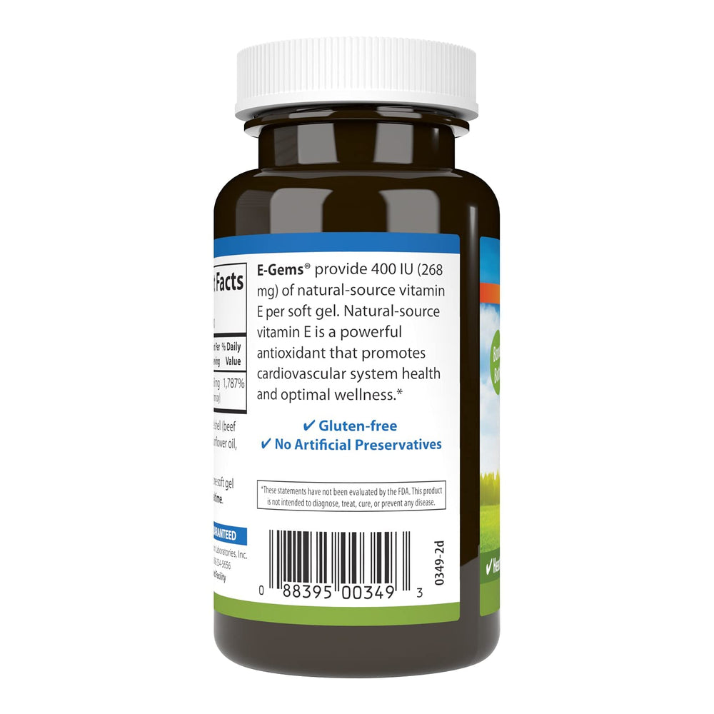 Carlson E-Gems softgels in hand for easy daily supplementation.