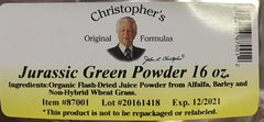 Christopher's Original Formulas Jurassic Green Powder scoop beside glass for easy mixing.