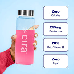 Glass of Cira Hydration Powder Fruit Punch after stirring for a refreshing drink.