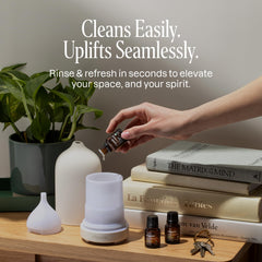 Cliganic diffuser on a home office desk, ideal for aromatherapy sessions.
