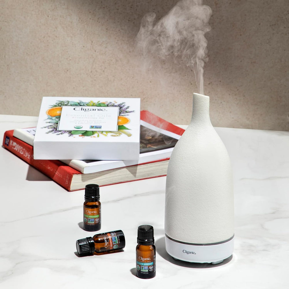 Cliganic tea tree essential oil bottle with clean scent for uplifting cleaning routines