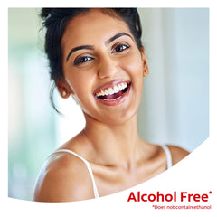 Mouthwash beside toothbrush demonstrates post-brushing routine with Colgate Optic White.