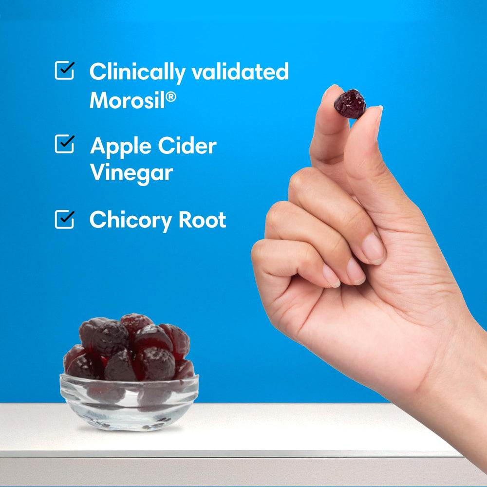 Gummies being taken with water to support a convenient daily routine.