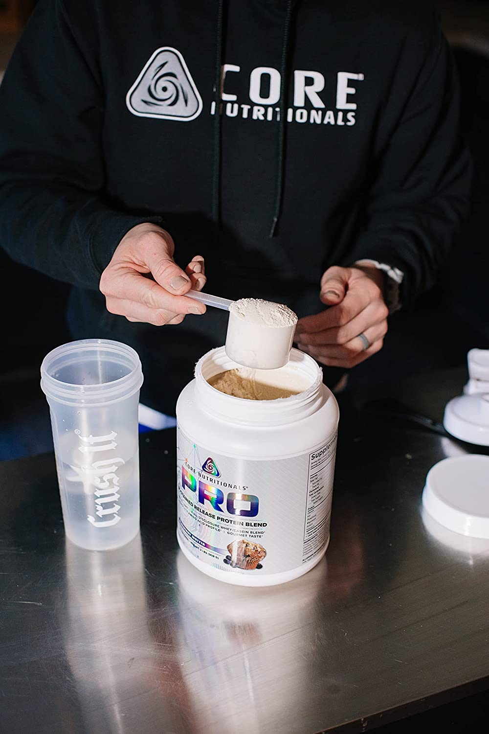 Core Nutritionals scoop beside powder, easy to measure and mix