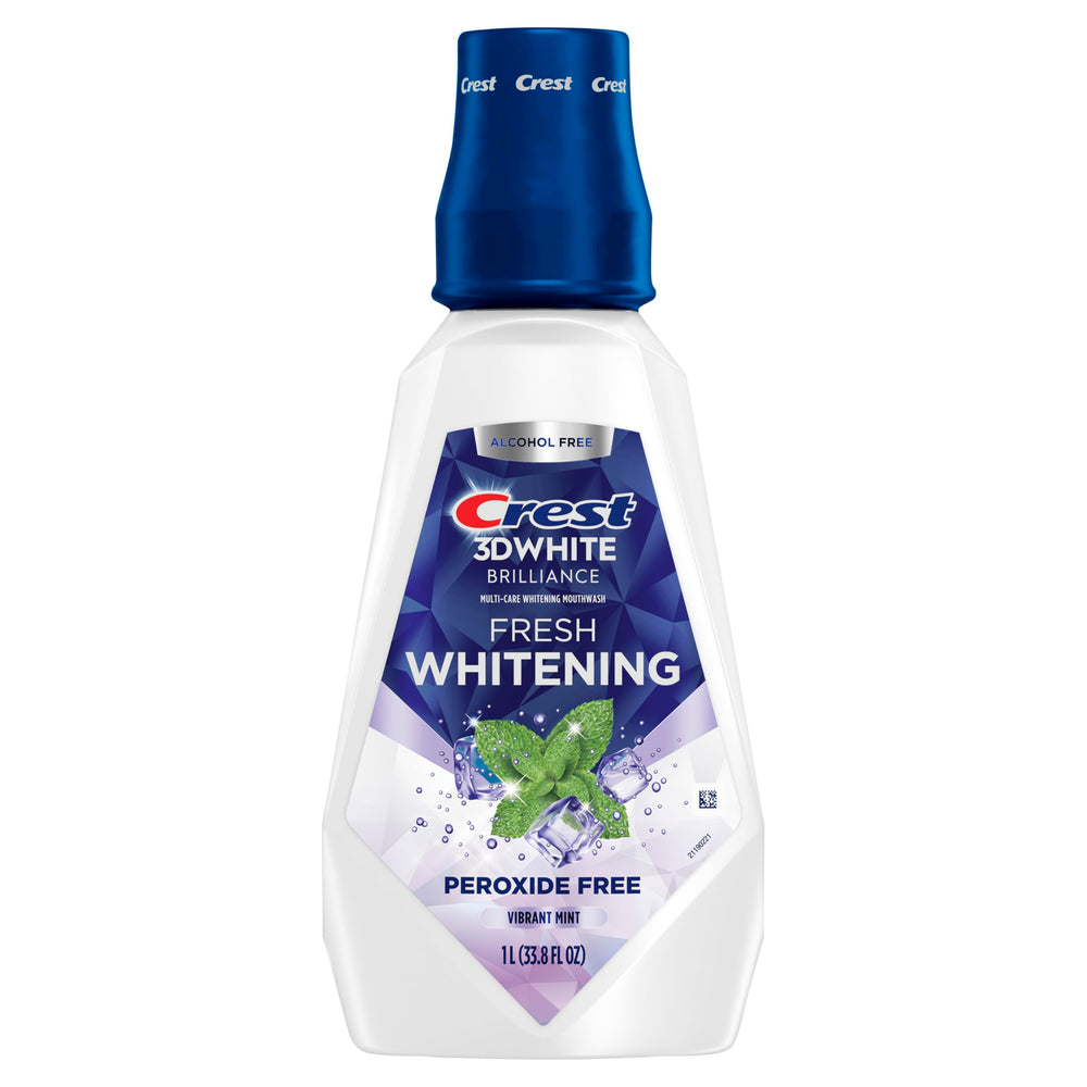 Crest 3D White Brilliance teeth rinse effect suggesting whitening progress.