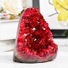 CrystalHola Claret raw geode with druzy sparkles on a desk display