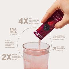 Cure Hydration Berry Pomegranate being poured into glass for on-the-go hydration.