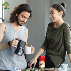 Amla, Giloy and Pippali notes in Dabur Chyawanprash spread.