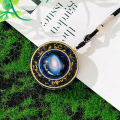 Day Day Up Nebula rotatable pendant with obsidian promotes balance and positive energy.