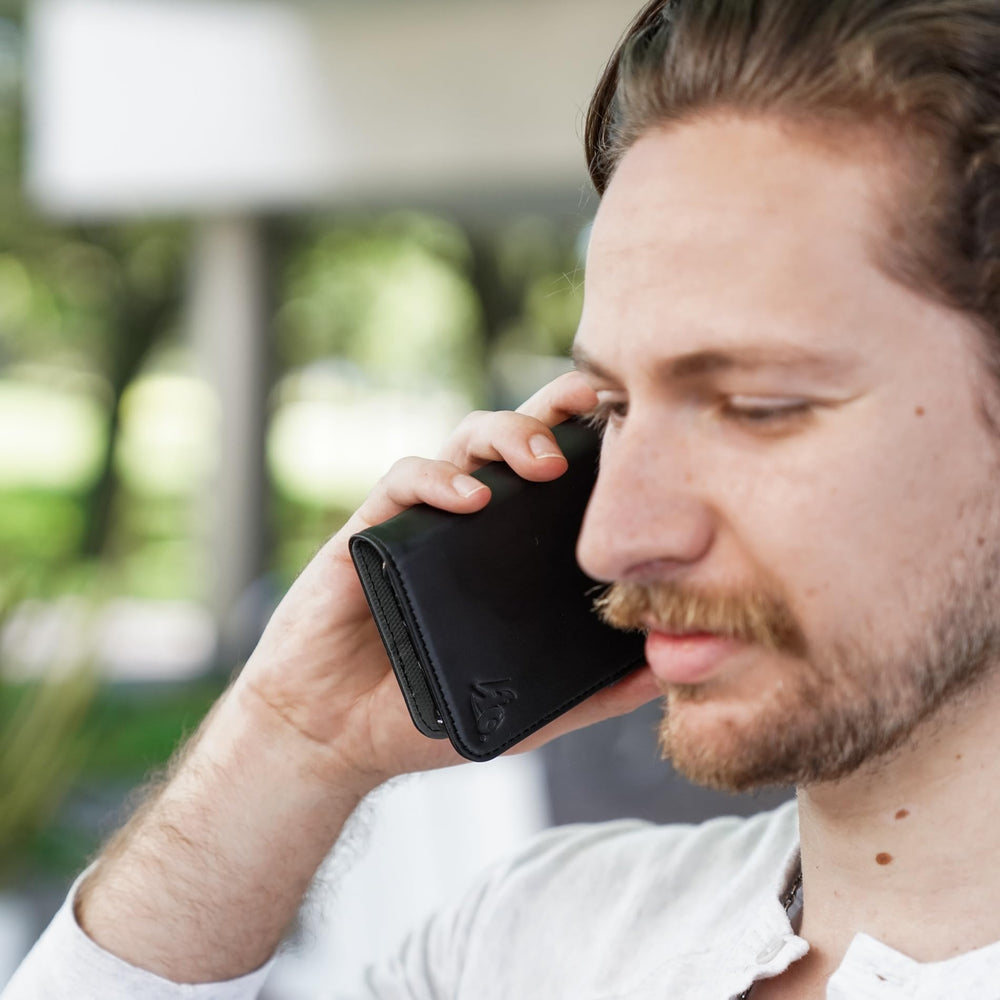 DefenderShield magnetic closure enables secure wallet use and hands-free viewing