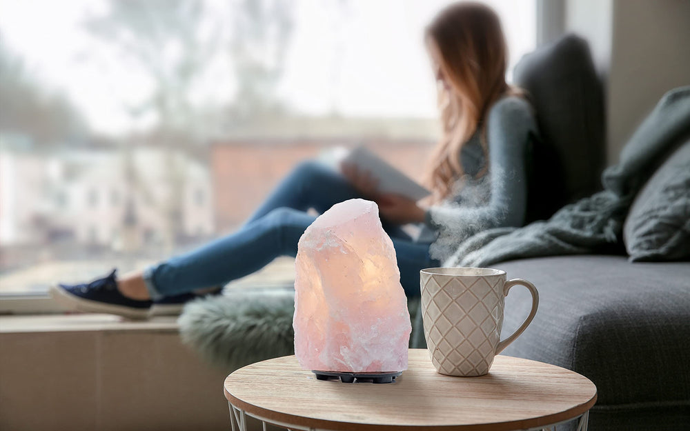 DesertUSA Rose Quartz Lamp side view shows natural stone with a soft pink glow.