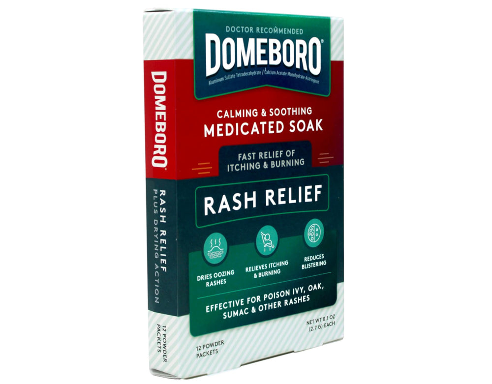 Domeboro packets dissolving in water to soothe irritated skin