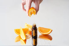 doTERRA Wild Orange bottle label close-up highlighting purity and scent.