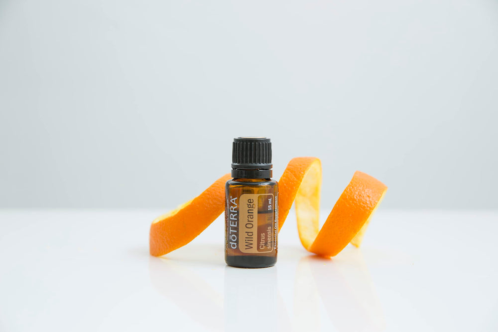 doTERRA Wild Orange bottle in kitchen cleaning spray idea.