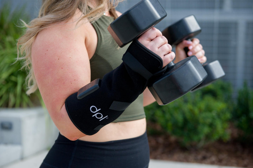 DPL wrap worn during typing at a desk for wrist comfort.