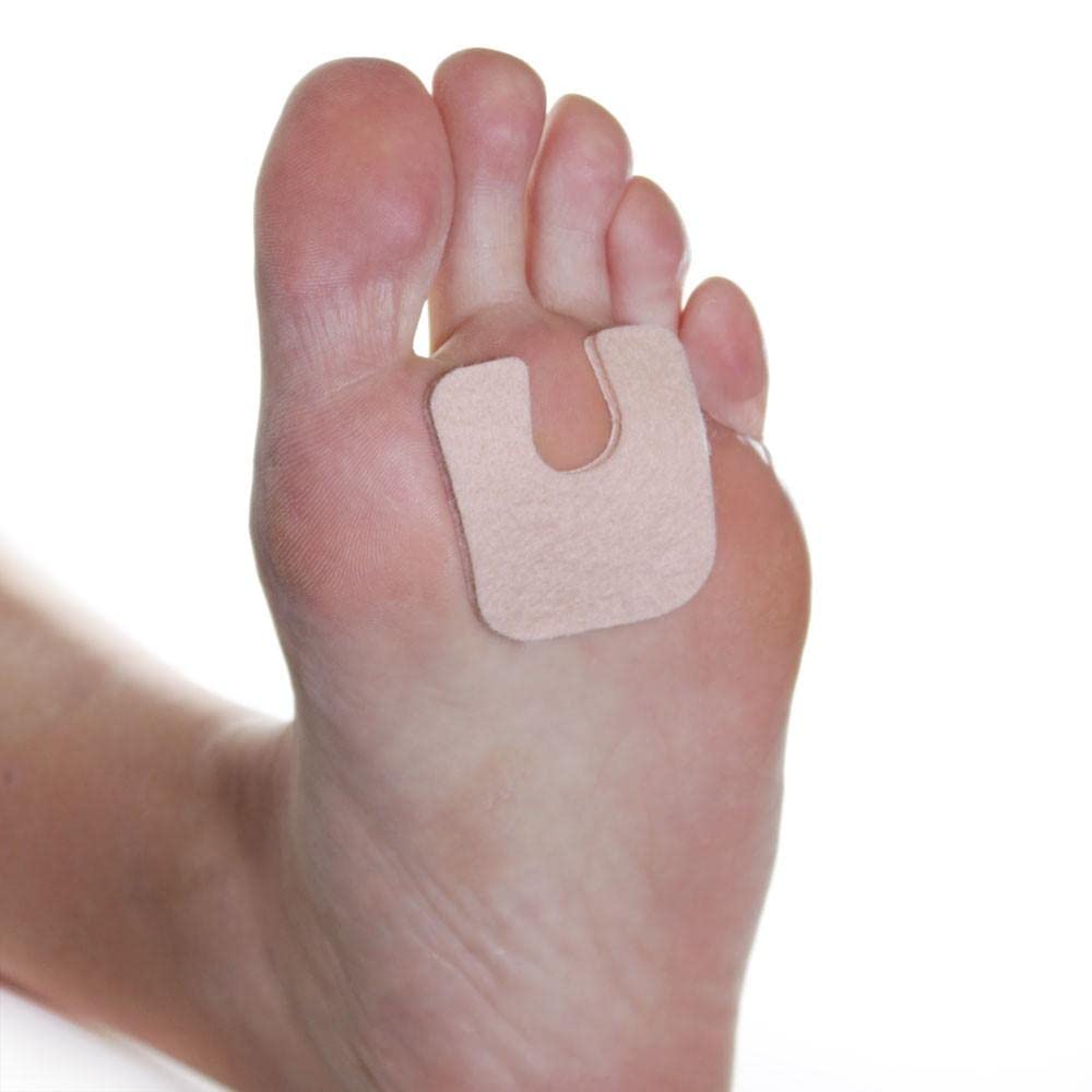 Dr. Jill's Foot Pads U-shaped callus pad on foot provides targeted pressure relief.