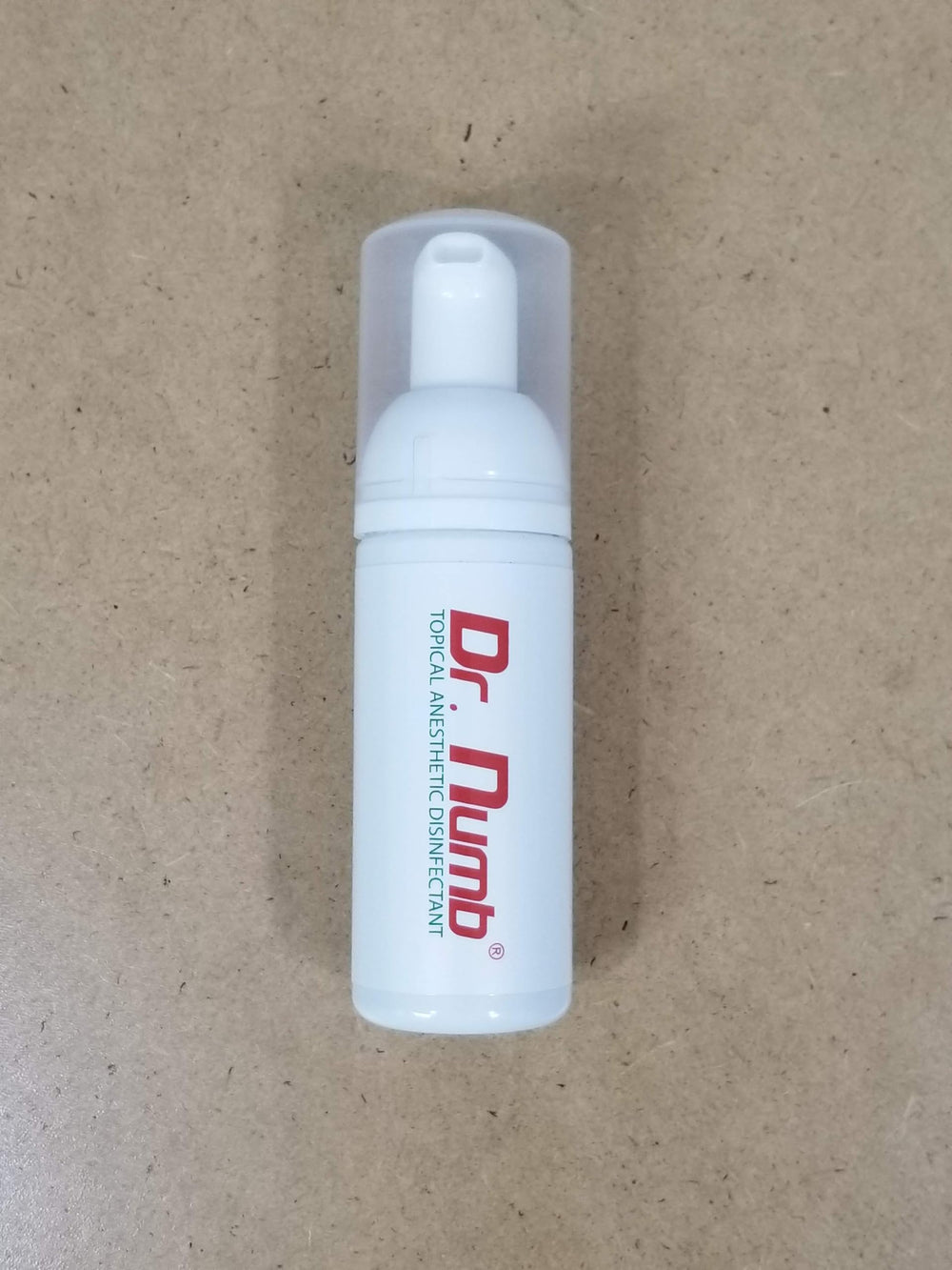 Dr. Numb travel-friendly compact bottle fits in toiletry bag for travel care.