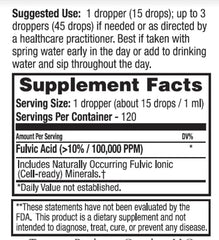 Pouring Dr. Tennant's Fulvic concentrate into a glass for easy daily intake