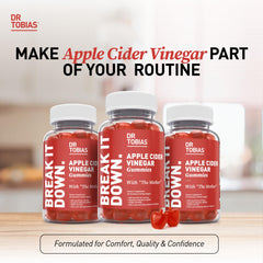 Person enjoying a Dr. Tobias Apple Cider Vinegar gummy for daily wellness.