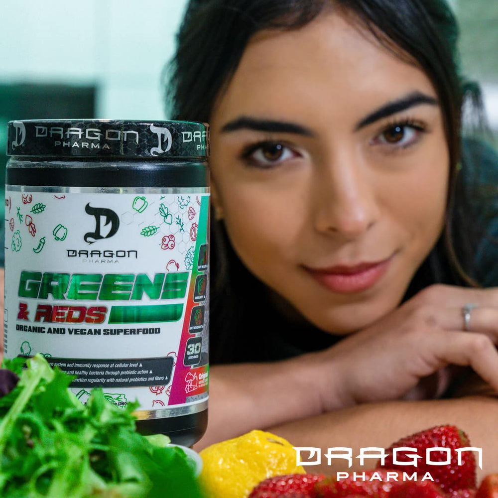 Dragon Pharma Greens and Reds powder being scooped for easy morning nutrition