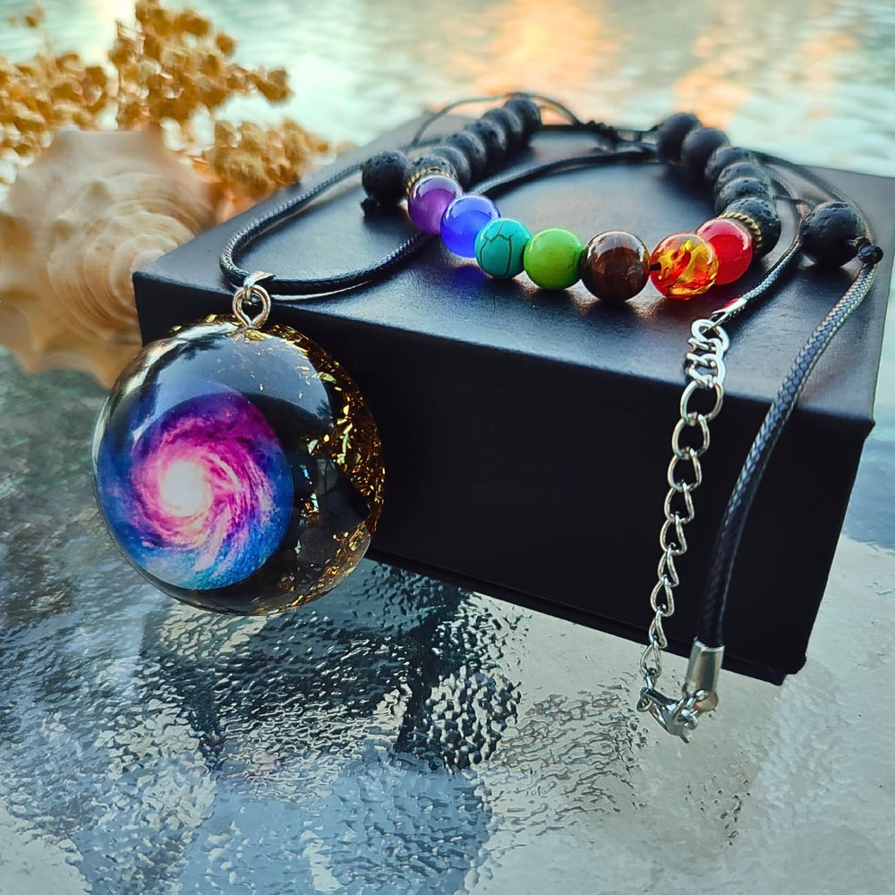 DREMINOVA orgonite chakra pendant on chain emphasizes balanced energy during meditation.