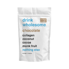 Drink Wholesome Chocolate Collagen Powder bag beside a glass, gentle digestion for sensitive stomachs