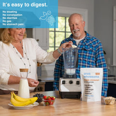 Shake glass with Drink Wholesome Maple Cinnamon Egg White Protein for easy mixing