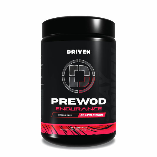 Driven PREWOD caffeine-free bottle on gym counter showing clean energy for training