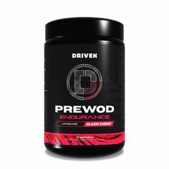 Driven PREWOD caffeine-free bottle on gym counter showing clean energy for training