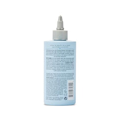 Drybar Liquid Glass rinse noir scent with ginger, mint, sandalwood.