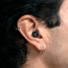 Earplugs with tips and compact case highlight portability of Eargasm Blackout.