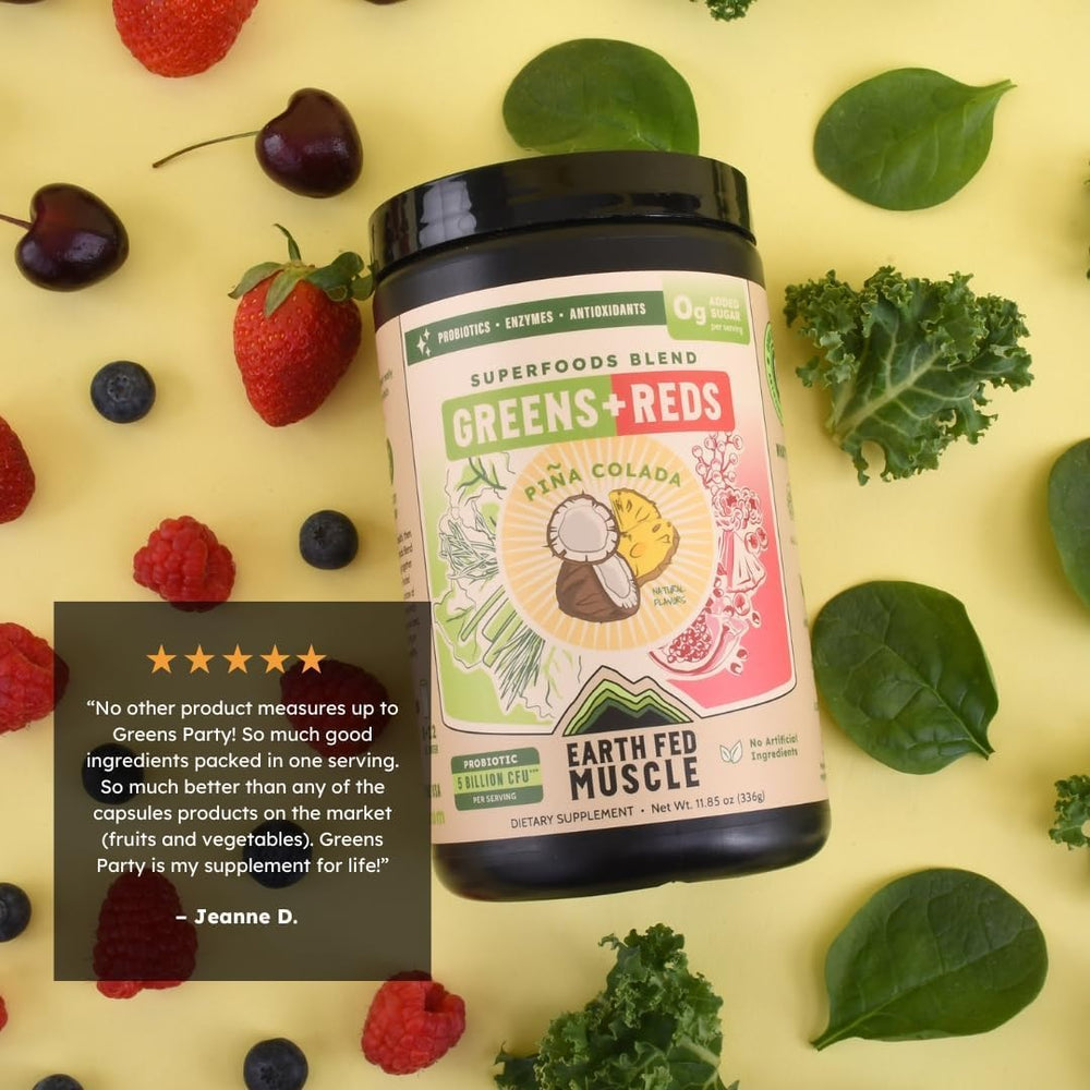 Earth Fed Muscle Pineapple Pomegranate ingredients display, tropical reds and greens.