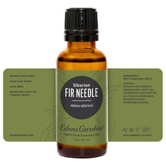 Woodgrain backdrop with Edens Garden Fir Needle Siberian bottle.